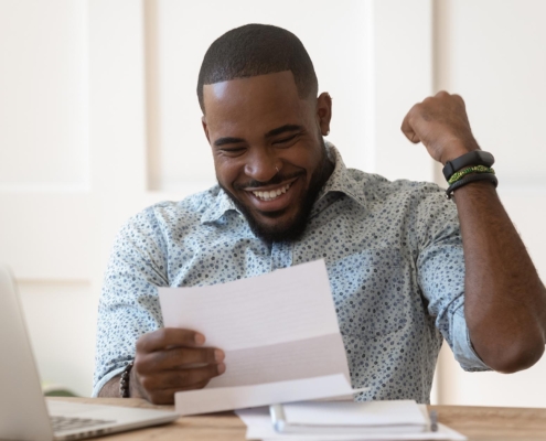 Image of a person excited over their loan approval.