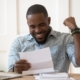 Image of a person excited over their loan approval.