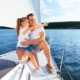 Father sitting with daughter on boat.